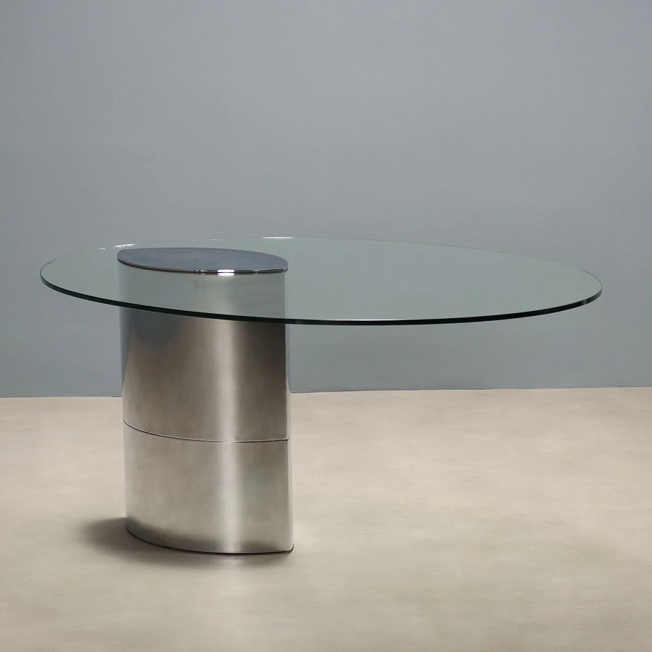 Table with glass top and stamped steel base, 20th century 1