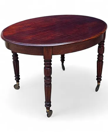 Extendable mahogany table with casters, 19th century
