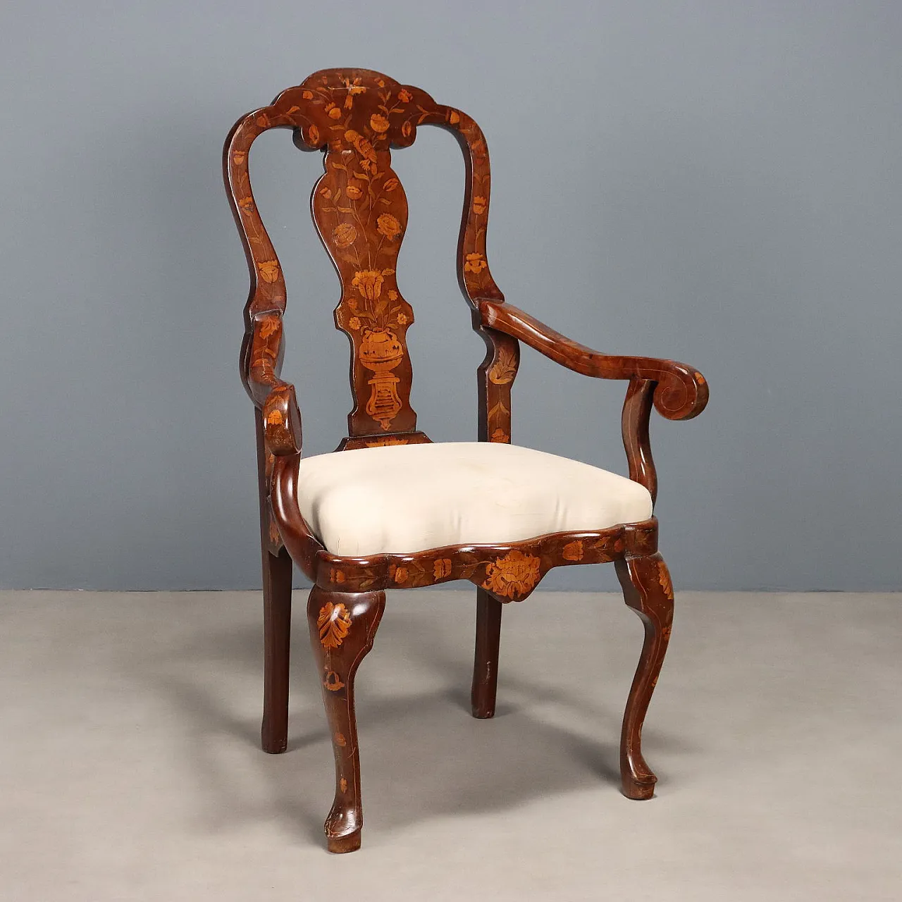 Walnut armchair with threads and floral carvings, 19th century 1