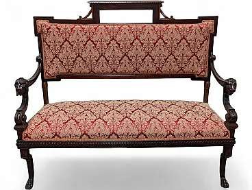 Wooden sofa with lion head armrests and red fabric, 19th century
