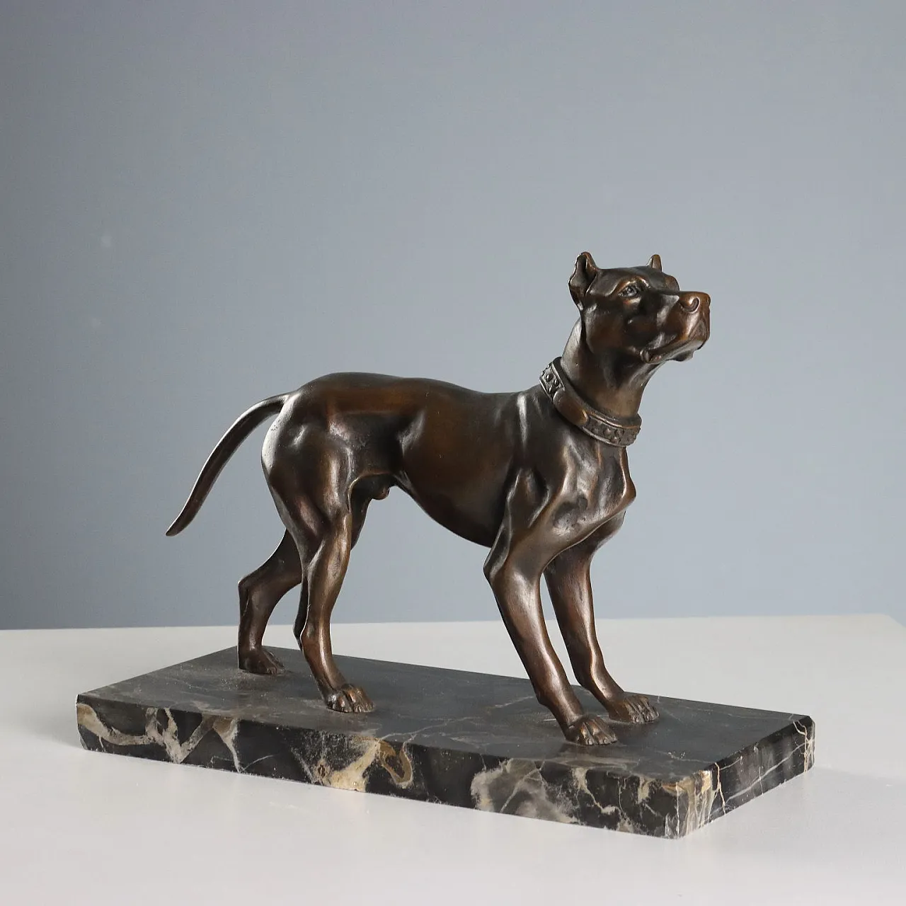 Bronze dog on black marble base, 20th century 1