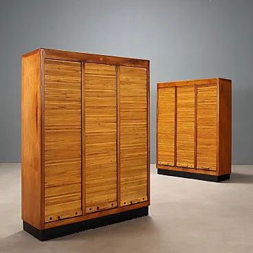 Pair of walnut veneered containers with laminate top, 20th century