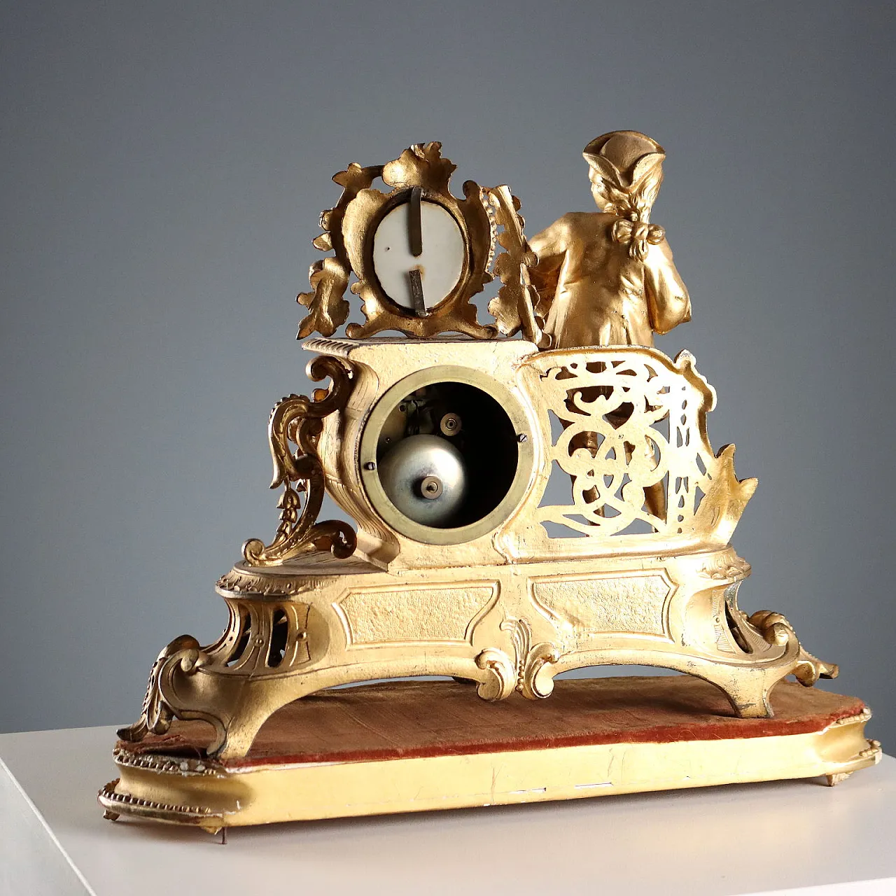 Golden antimony clock on wooden base, 20h century 10