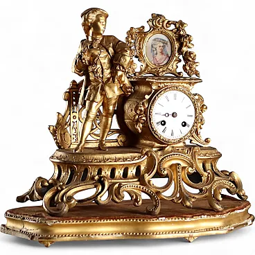 Golden antimony clock on wooden base, 20h century