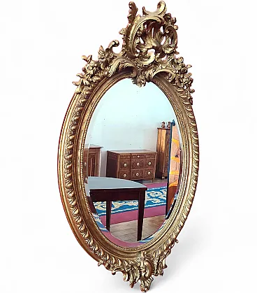 Oval gilded plaster mirror with cymatium, 19th century