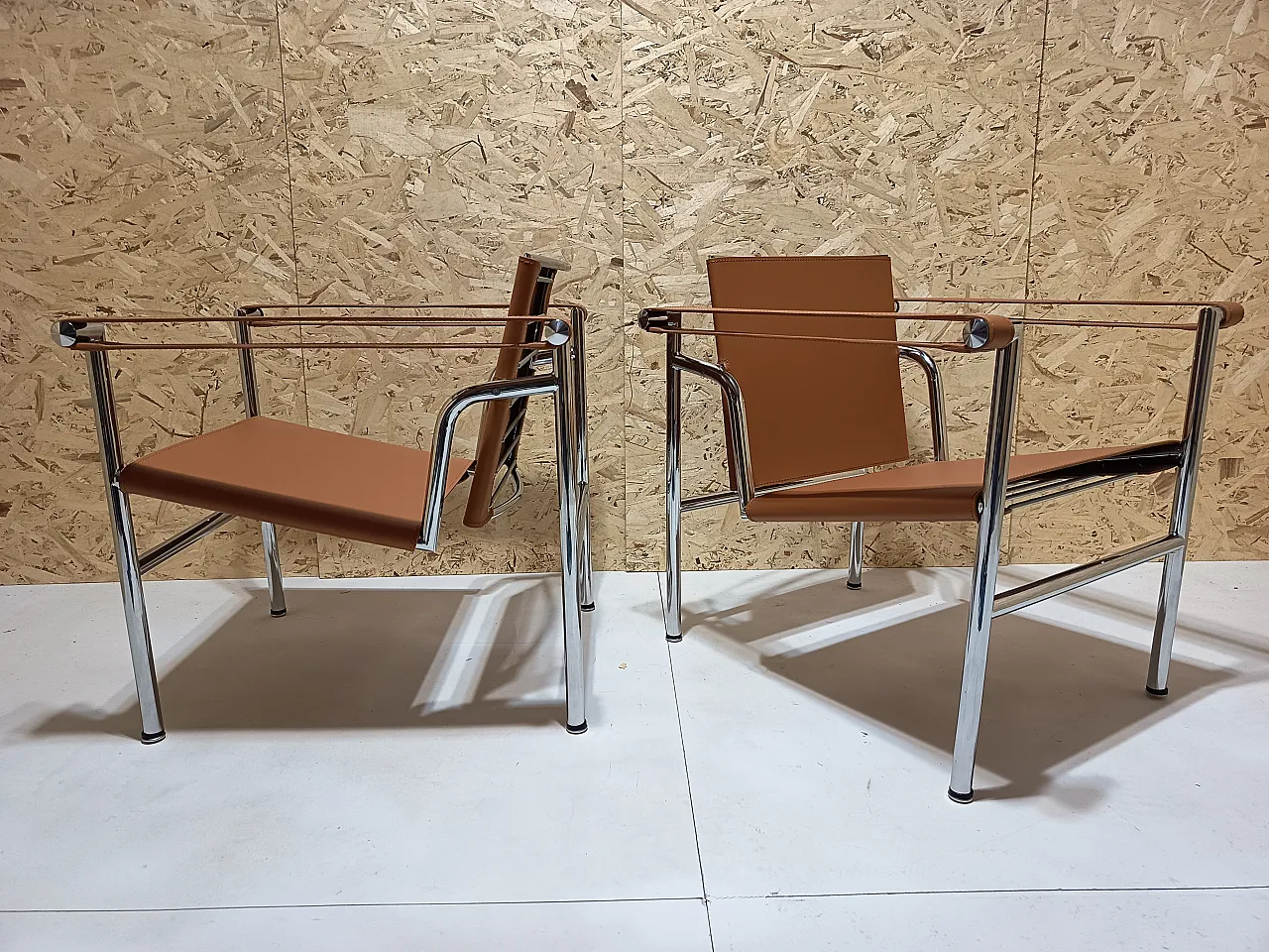 Pair of LC1 armchairs by Alivar in Cognac natural leather, 2000s 56