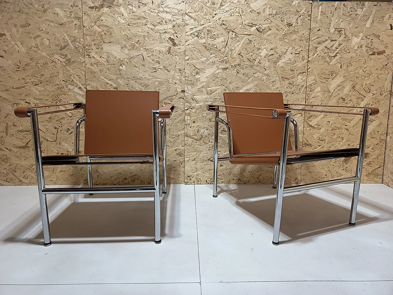 Pair of LC1 armchairs by Alivar in Cognac natural leather, 2000s 89