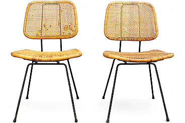 Pair of 550 dining chairs in wicker by Dirk Van Sliedregt, 1950s