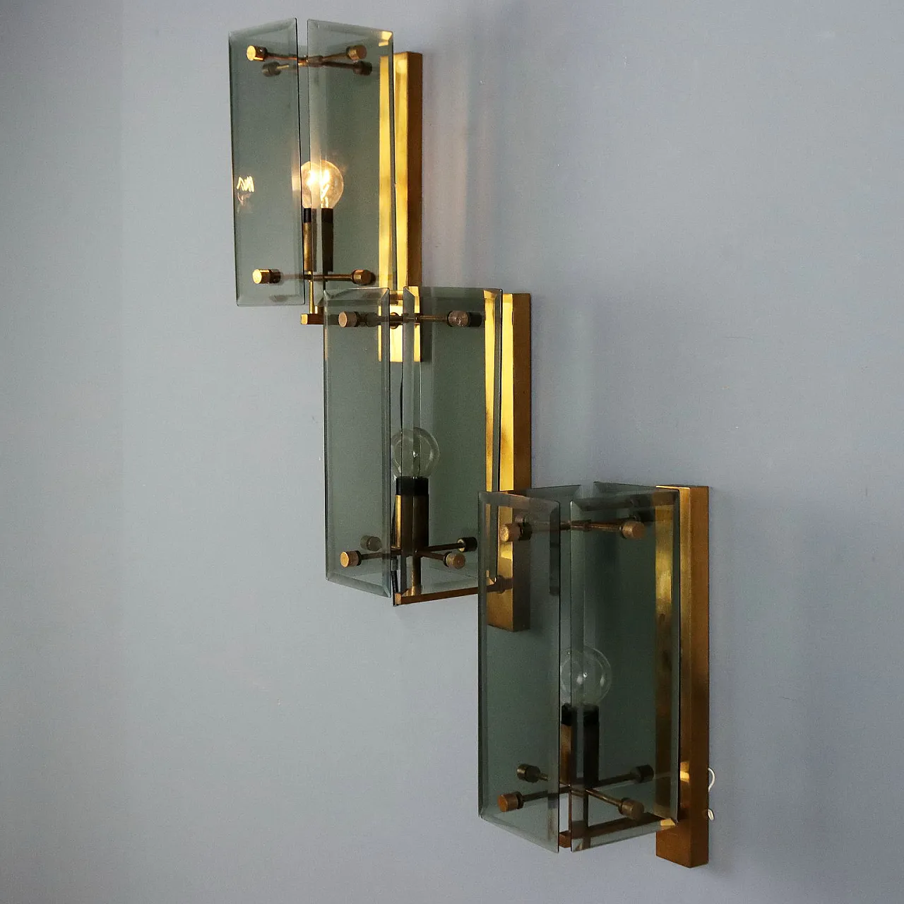 3 Wall lamps in brass and smoked glass, 1960s 1