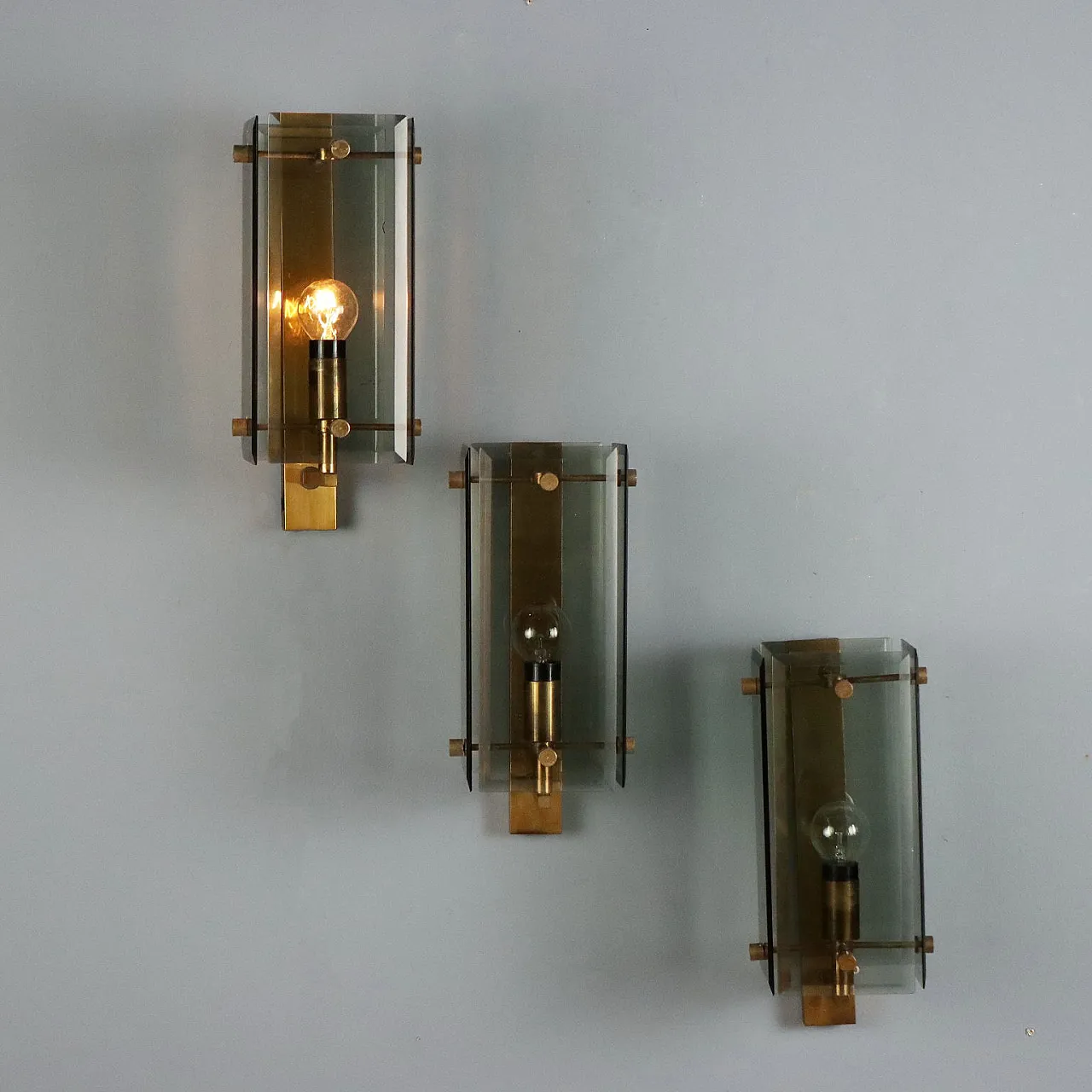 3 Wall lamps in brass and smoked glass, 1960s 3
