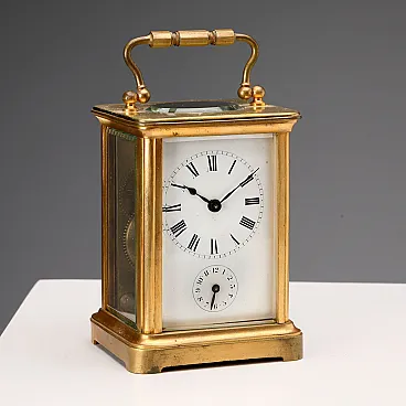 Travel clock in bronze and glass, 19th century