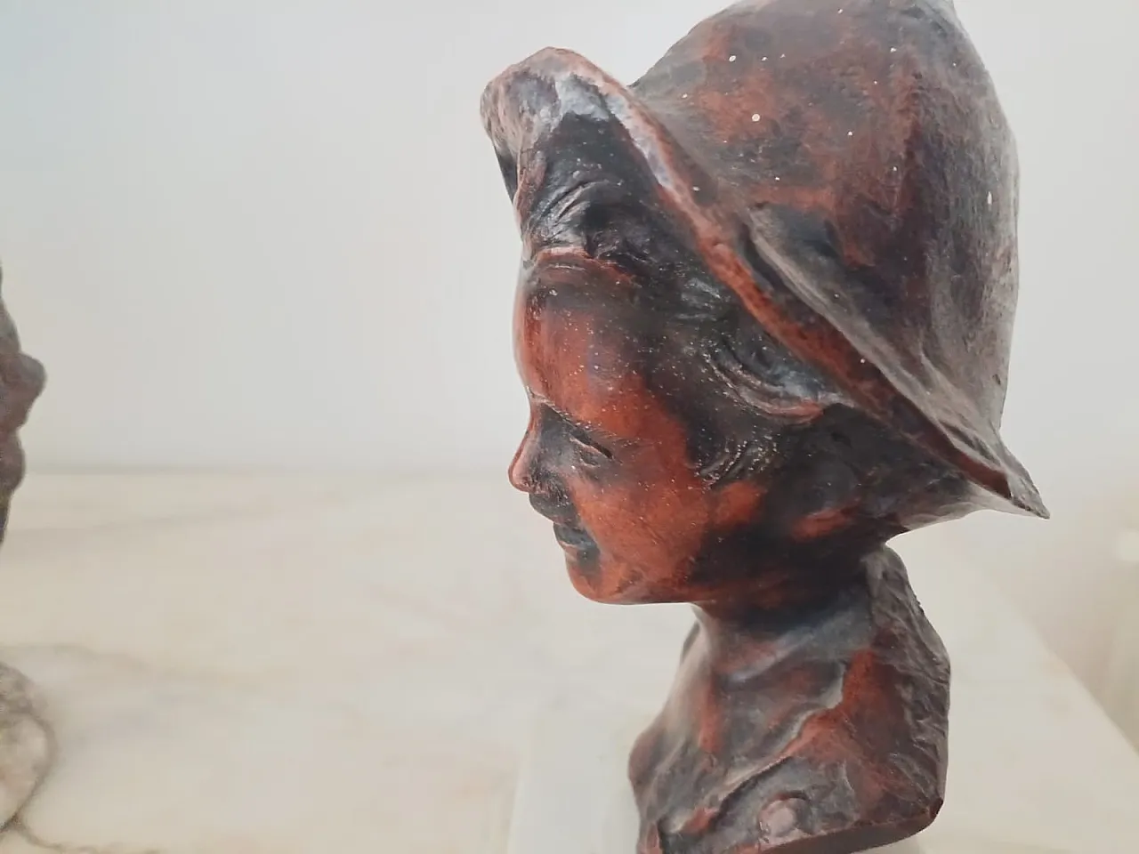 Bust of a young boy with hat, early 20th century 8