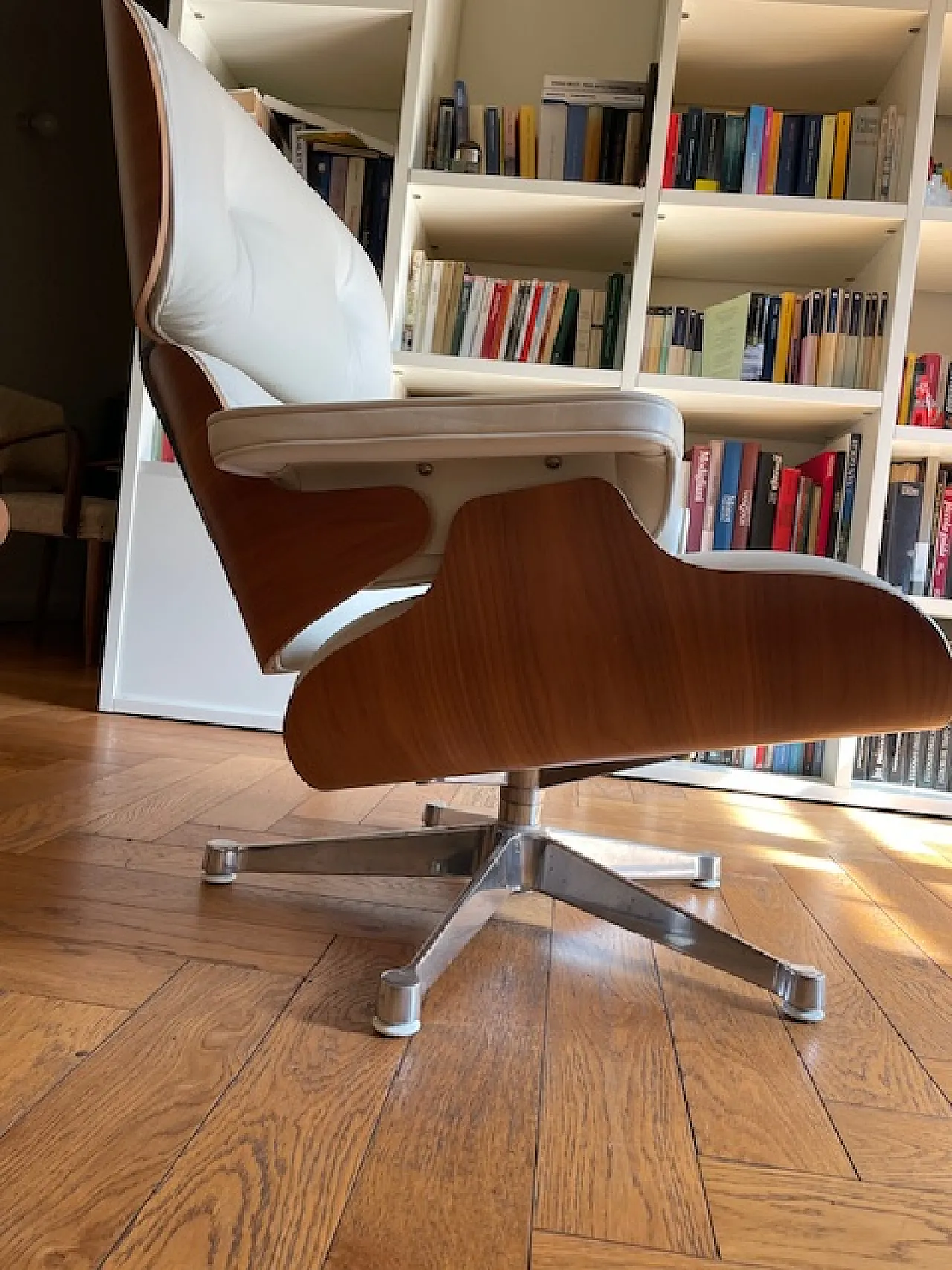 Lounge chair and pouf by Charles & Ray Eames for Vitra, 2000s 8