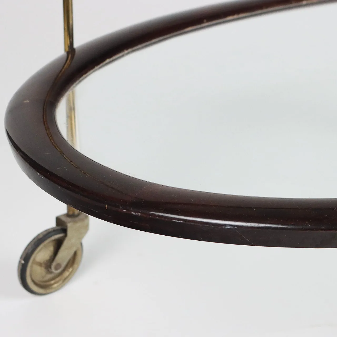 Oval ebony-stained wood and glass bar cart, 1950s 9