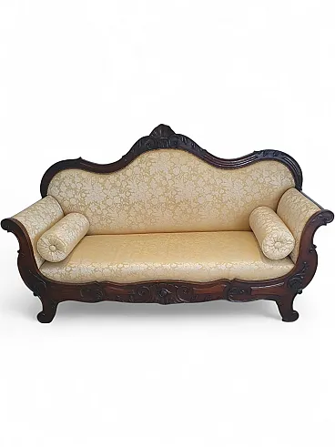 Carved sofa with floral upholstery