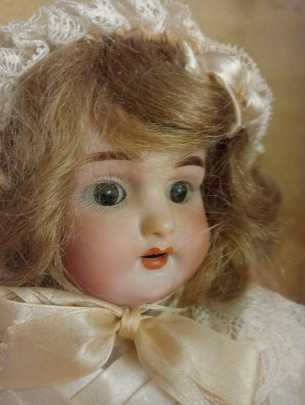 Antique doll in gilded case, late 19th century 1