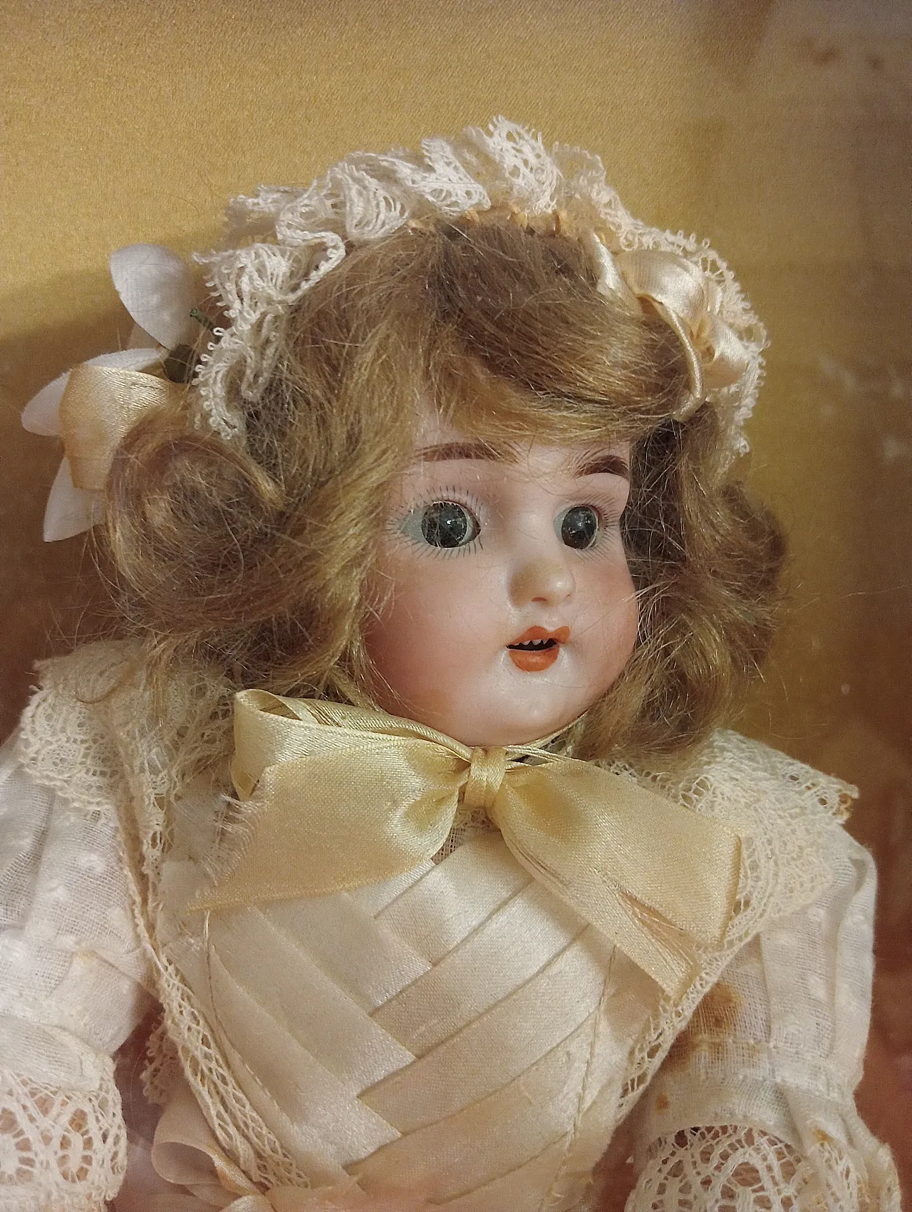 Antique doll in gilded case, late 19th century 2