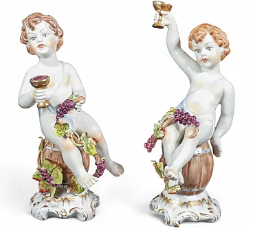 Putti Baccanti, coppia di sculture in porcellana dipinta a mano, '900