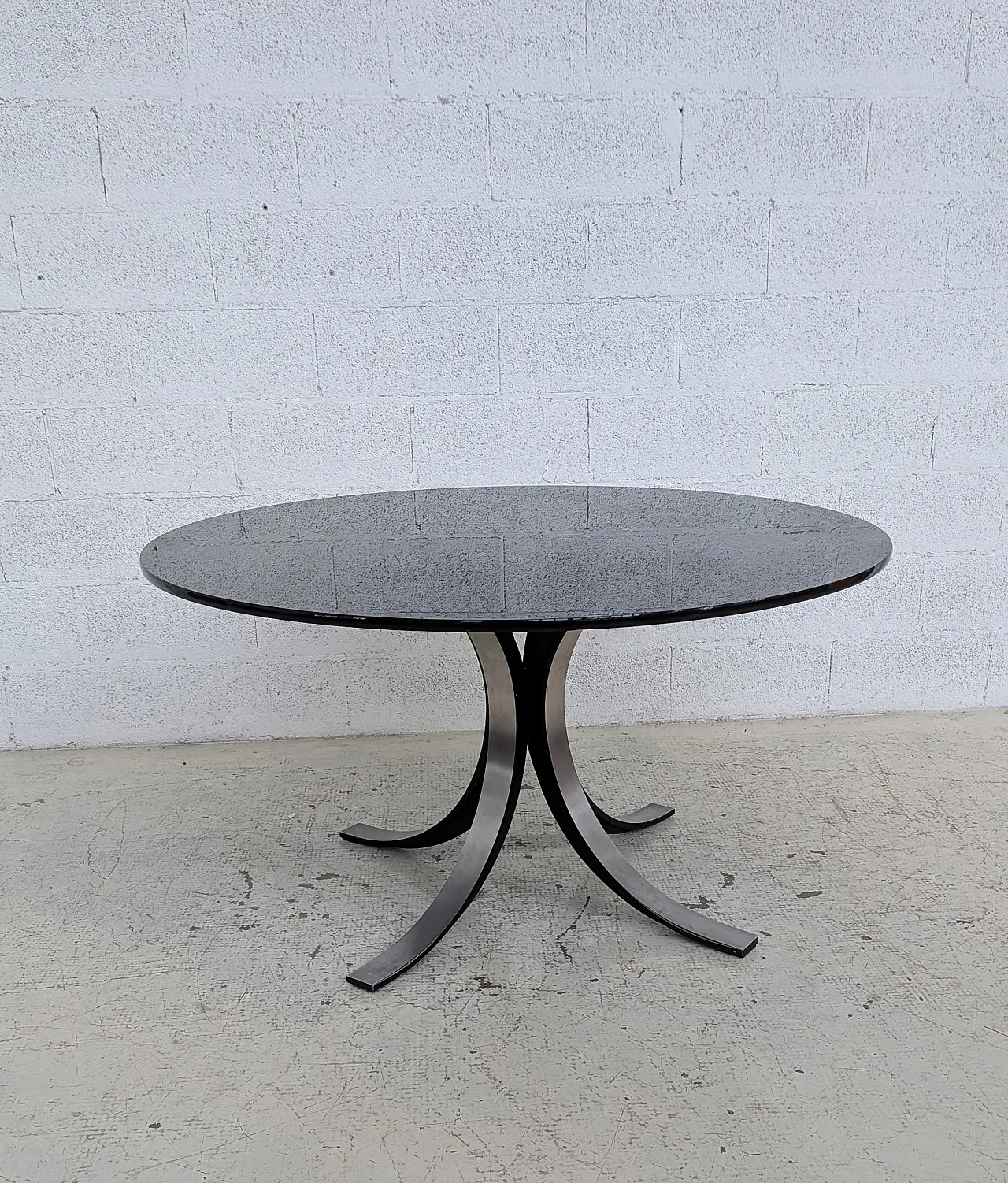 T69 table by Osvaldo Borsani and 4 wheeled chairs by Eugenio Gerli for 7
