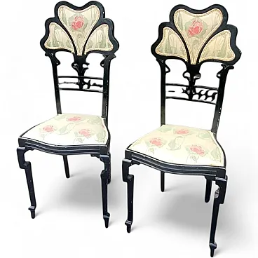 Pair of blackened wooden chairs with 3-petal backrests, 20th century