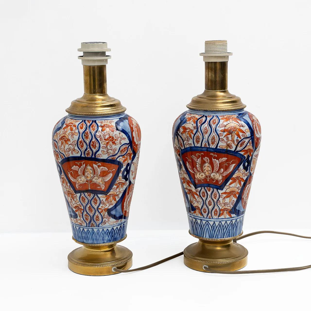 Pair of Imari Meiji porcelain vases with gilt bronze supports, 19th c. 2