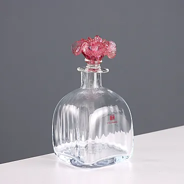 Ribbed blown glass bottle with rose-shaped cap, 20th century