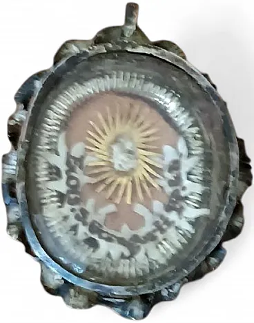 Silver reliquary with beveled crystal front, 19th century
