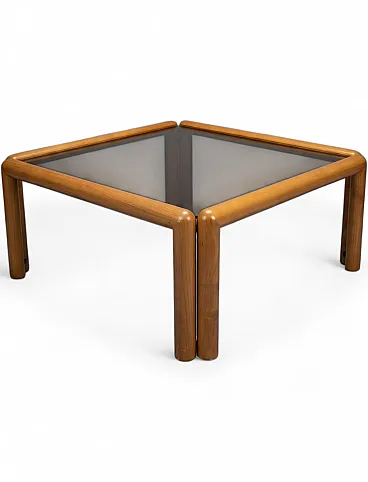 Square coffee table with rounded wooden structure and glass top