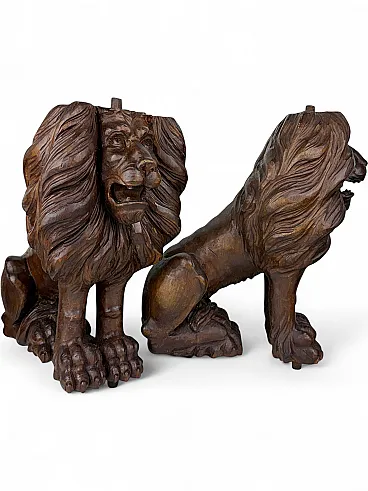 Pair of hand carved wooden lions, early 20th century