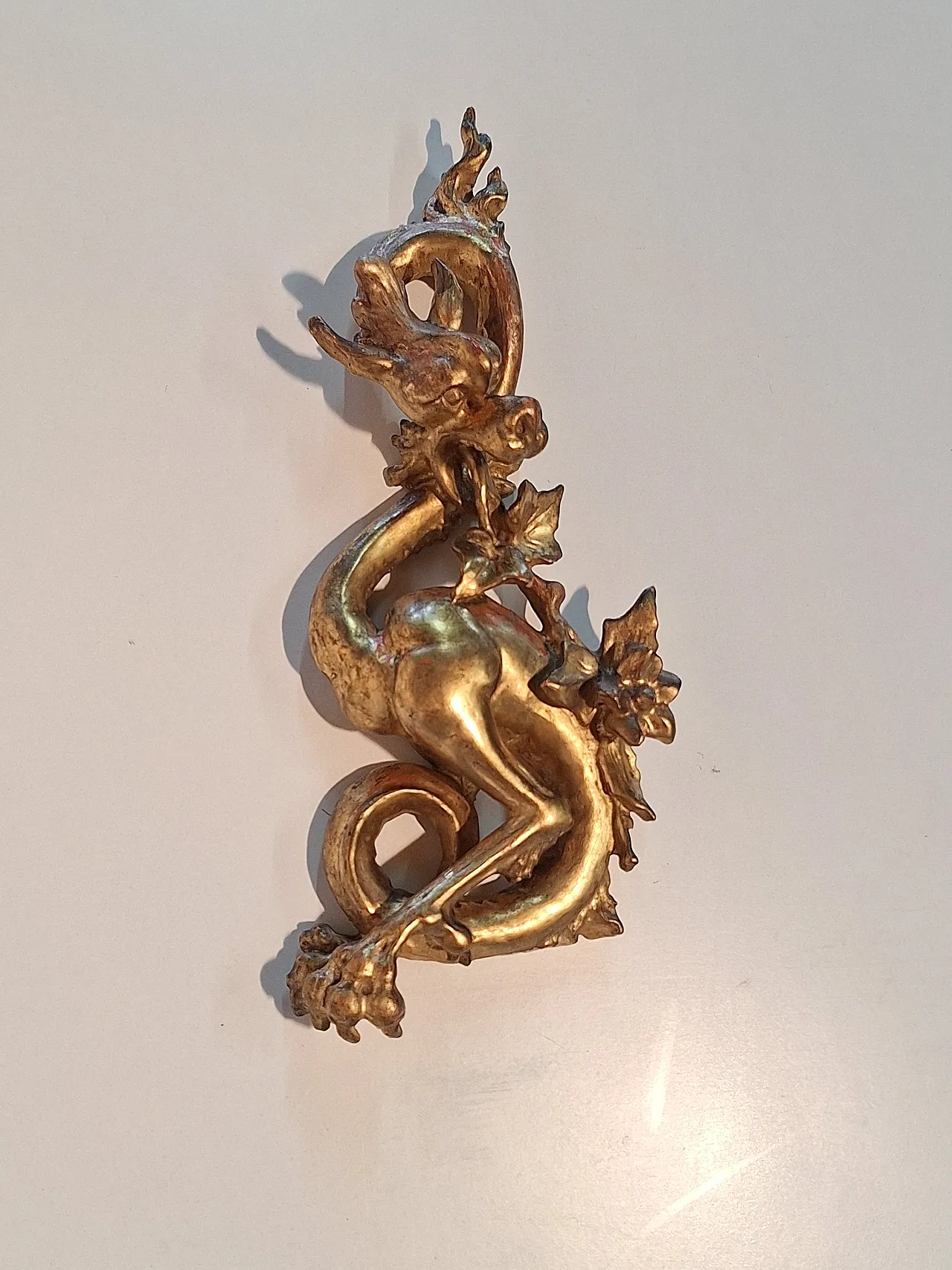 Pair of decorative elements in the shape of winged dragons, 19th c. 14