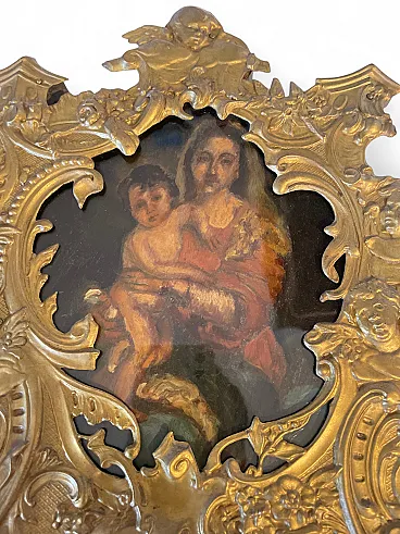 Pair of sacred icons in brass shell frames, 19th century