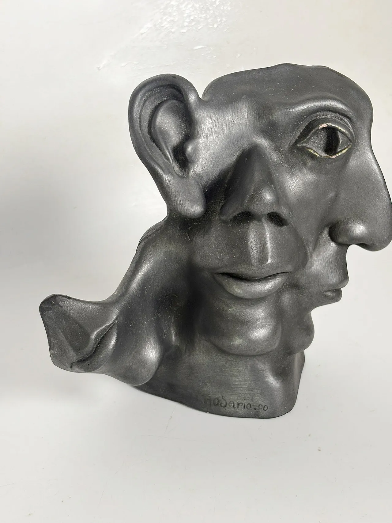 Patinated terracotta sculpture with multiple faces, 1960s 4