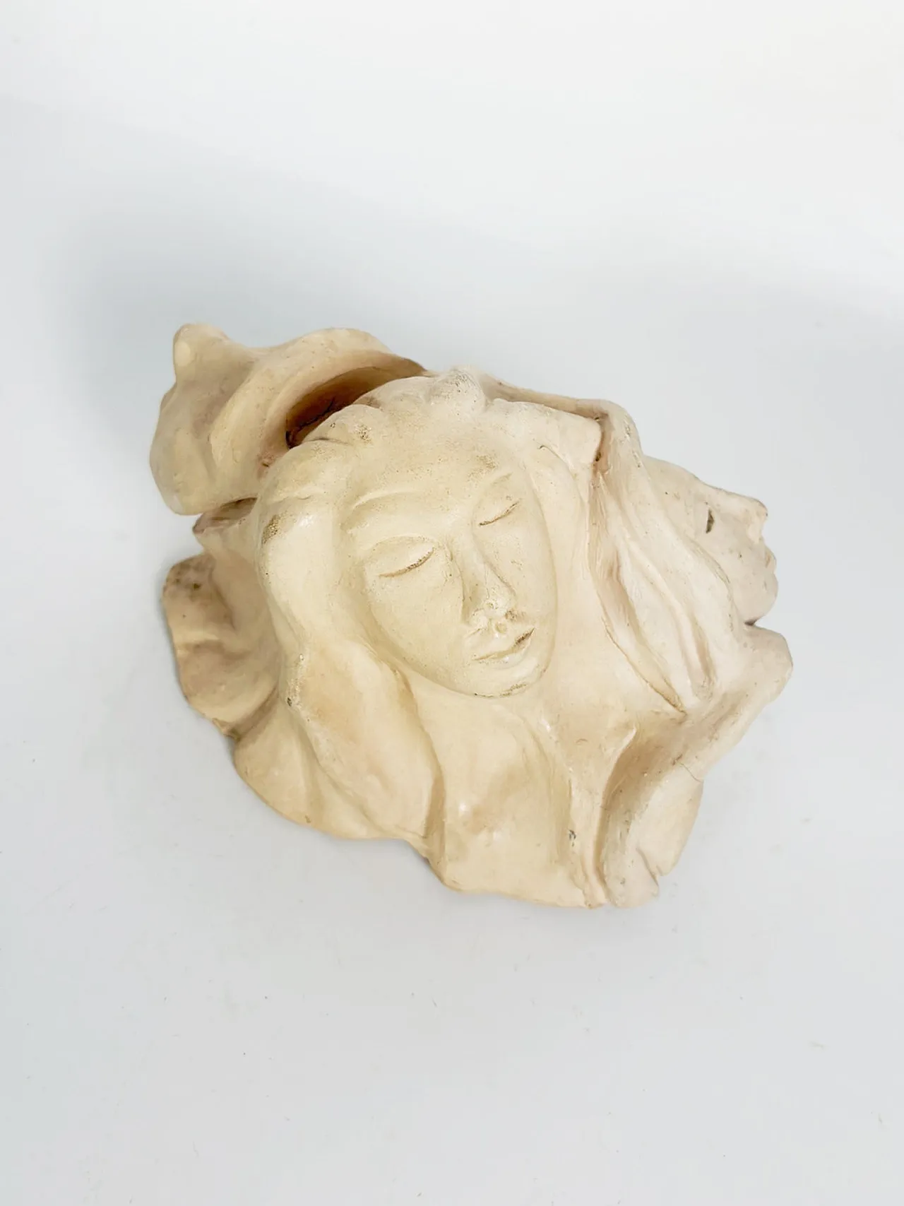 Raw clay sculpture with faces, 1980s 5