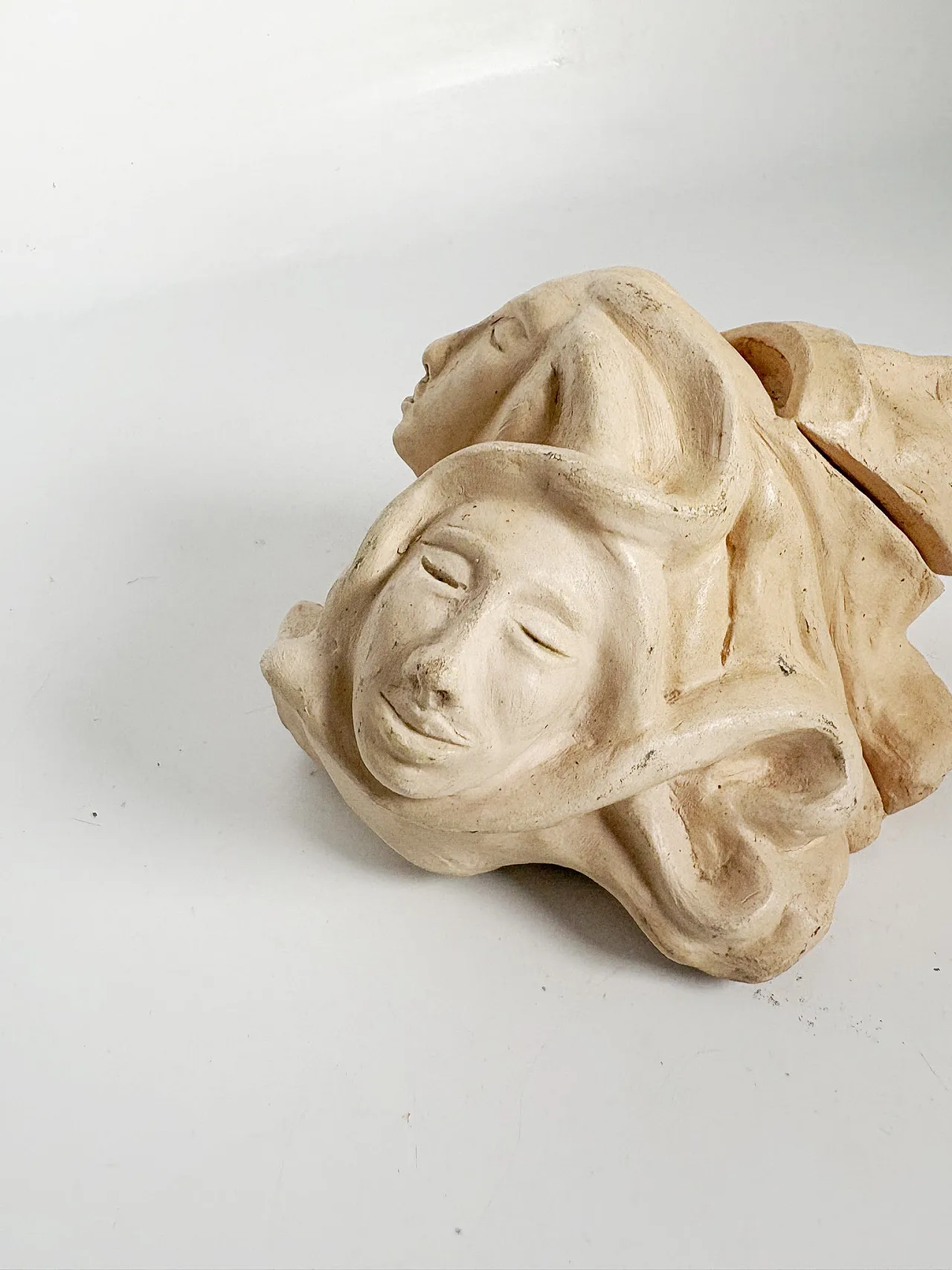 Raw clay sculpture with faces, 1980s 7