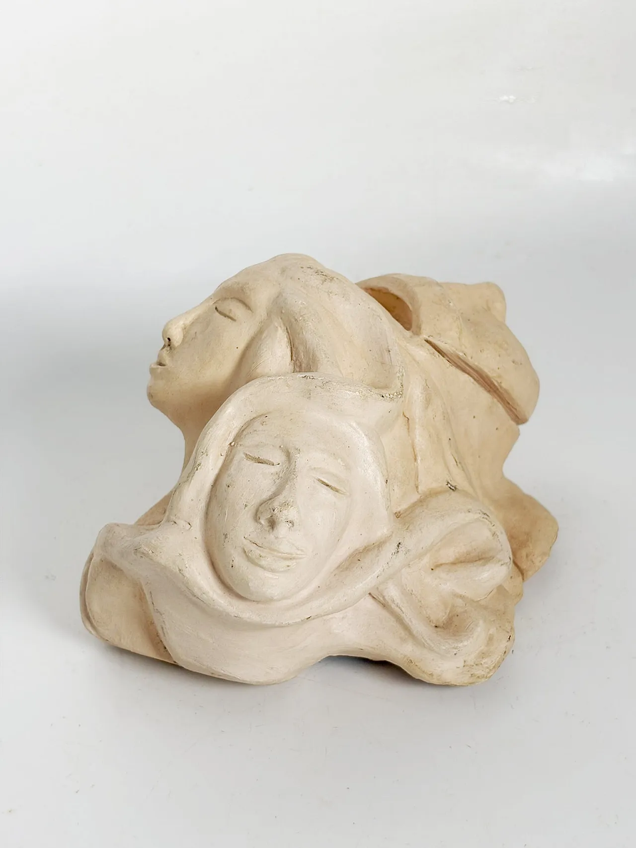 Raw clay sculpture with faces, 1980s 8