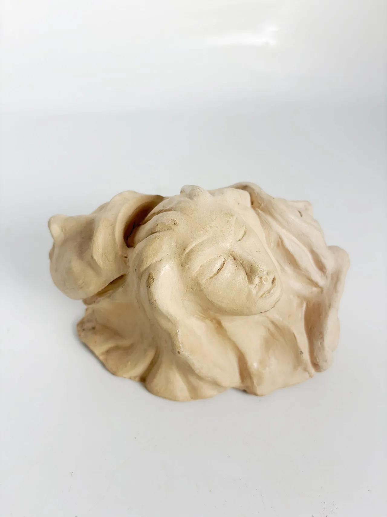 Raw clay sculpture with faces, 1980s 9