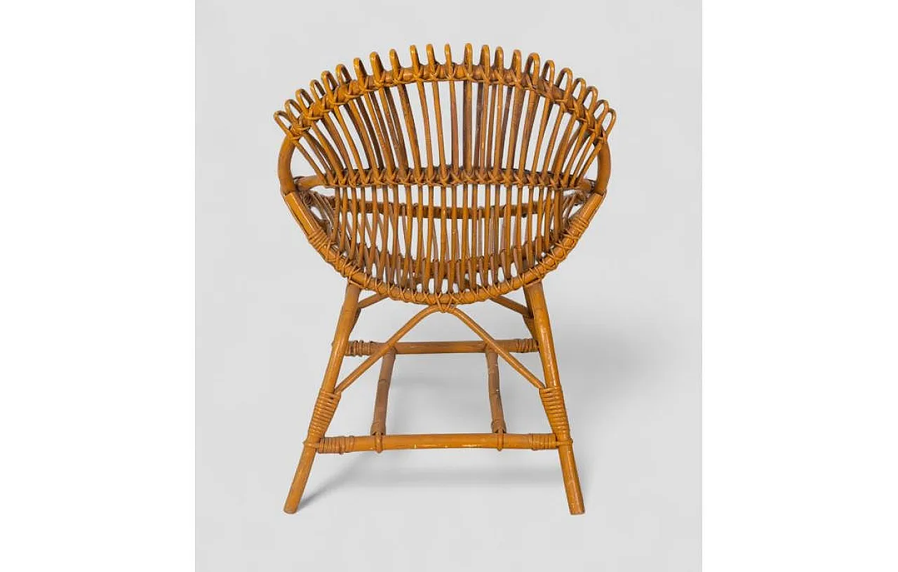 Curved shell armchair in rattan, 1970s 5