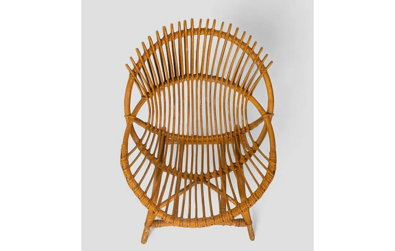 Curved shell armchair in rattan, 1970s 7