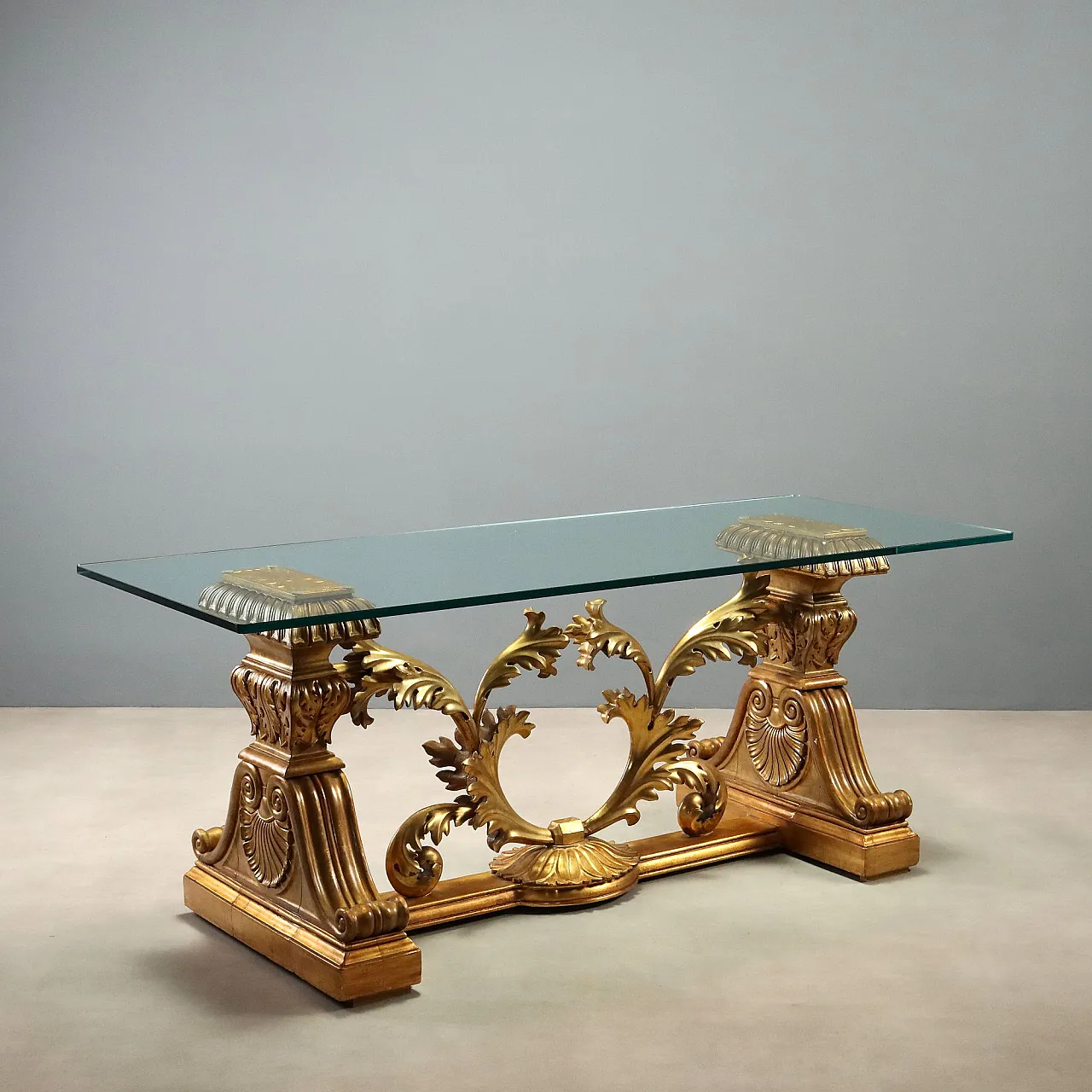 Table with carved and gilded wooden base, 20th century 1