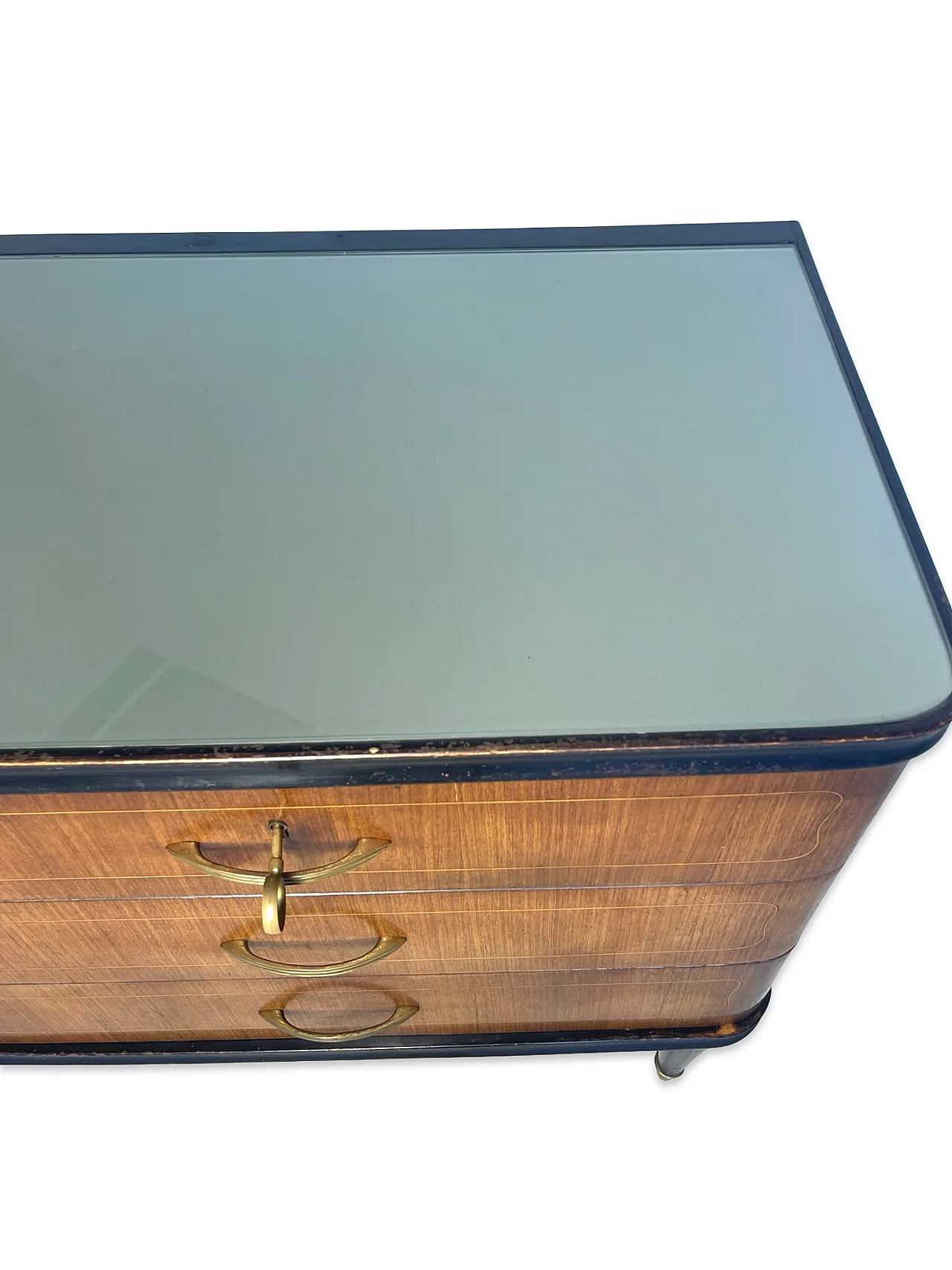Veneered mahogany chest of drawers with green glass top, 1950s. 26
