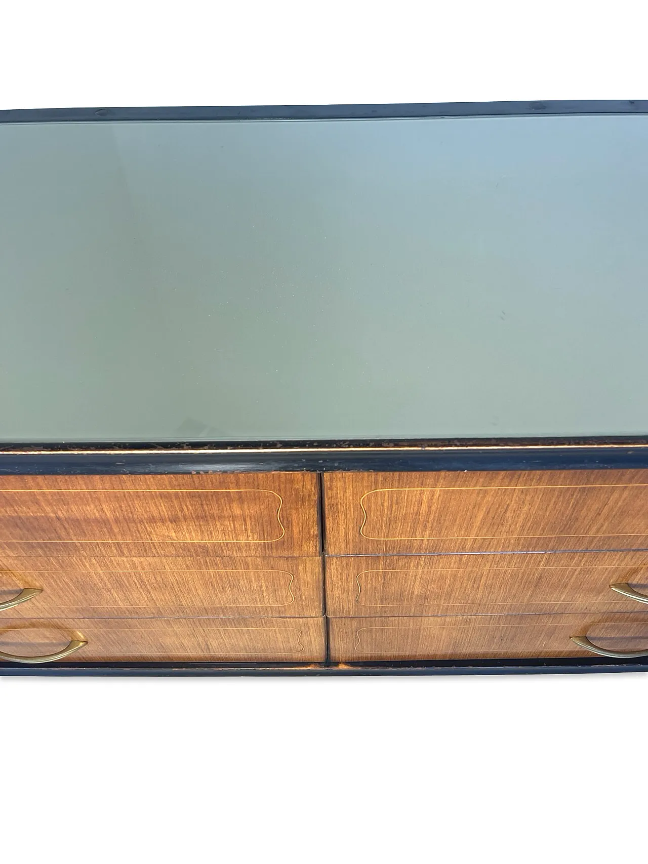 Veneered mahogany chest of drawers with green glass top, 1950s. 27