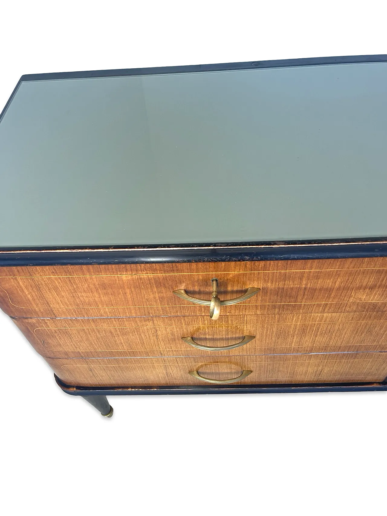 Veneered mahogany chest of drawers with green glass top, 1950s. 28