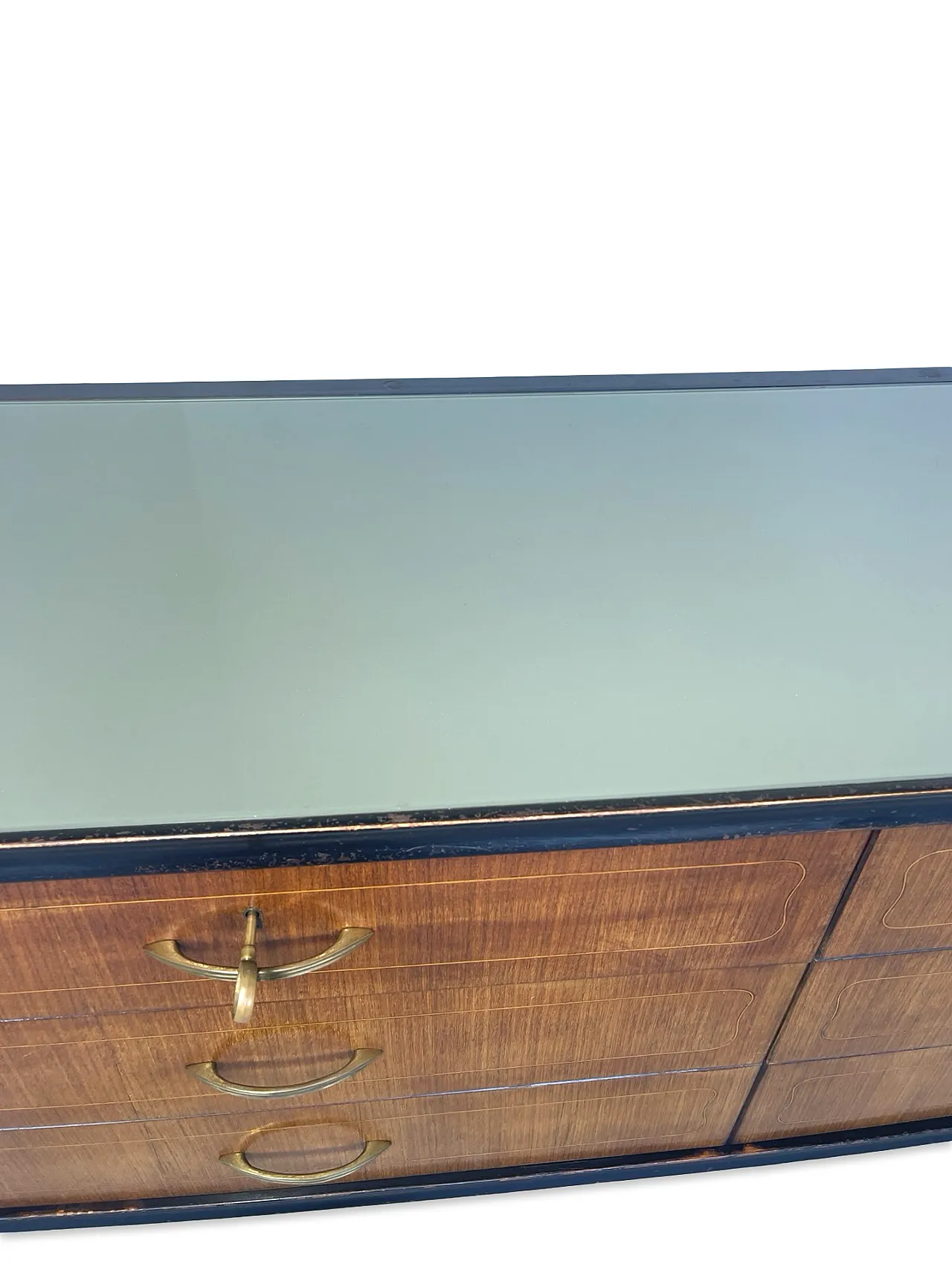 Veneered mahogany chest of drawers with green glass top, 1950s. 32