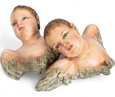 Pair of antique polychrome wooden winged cherubs,Naples, 18th century.