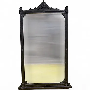 Black framed mirror with carved decorations, 20th century