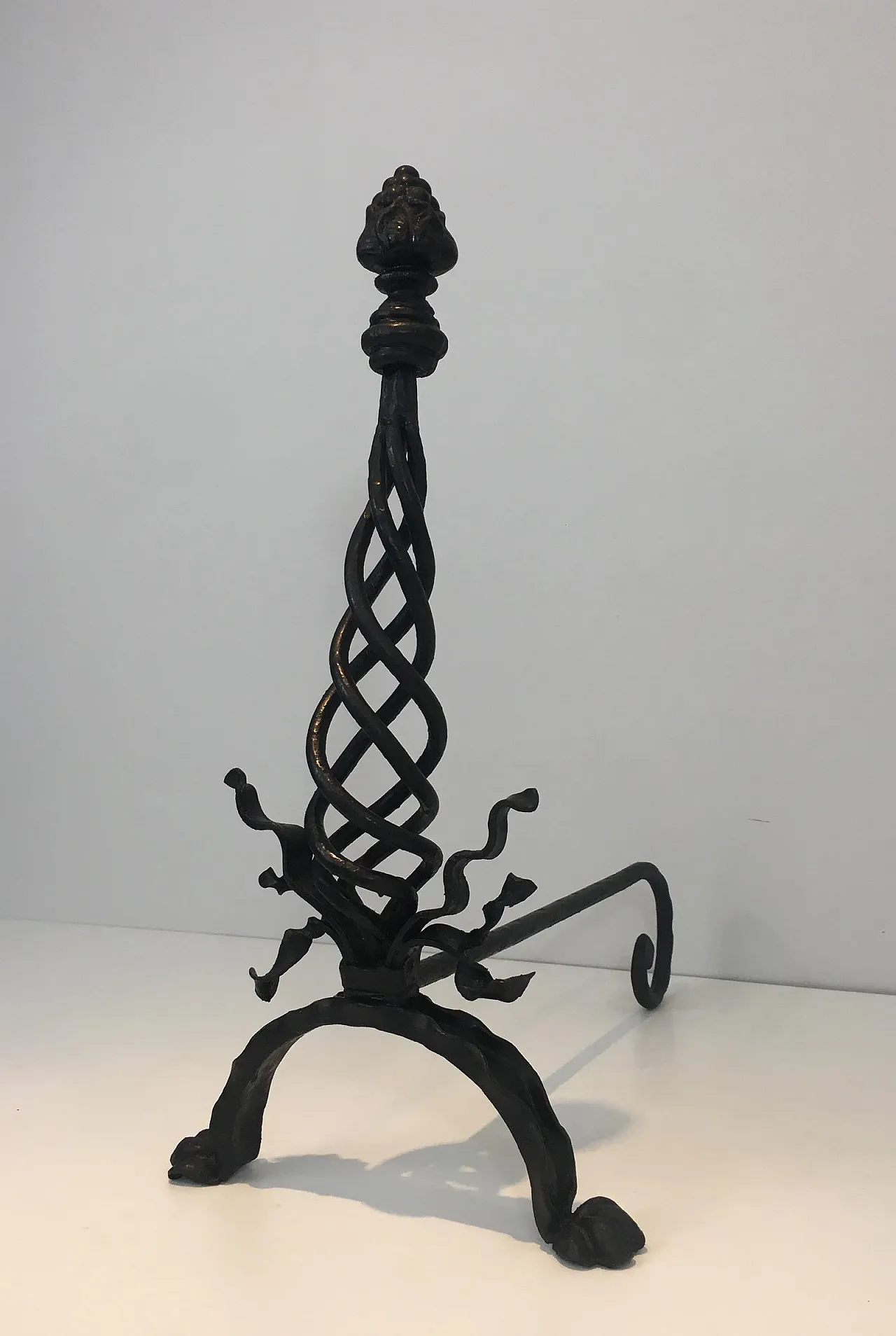 Pair of twisted wrought iron andirons with finials, French, 20s 6