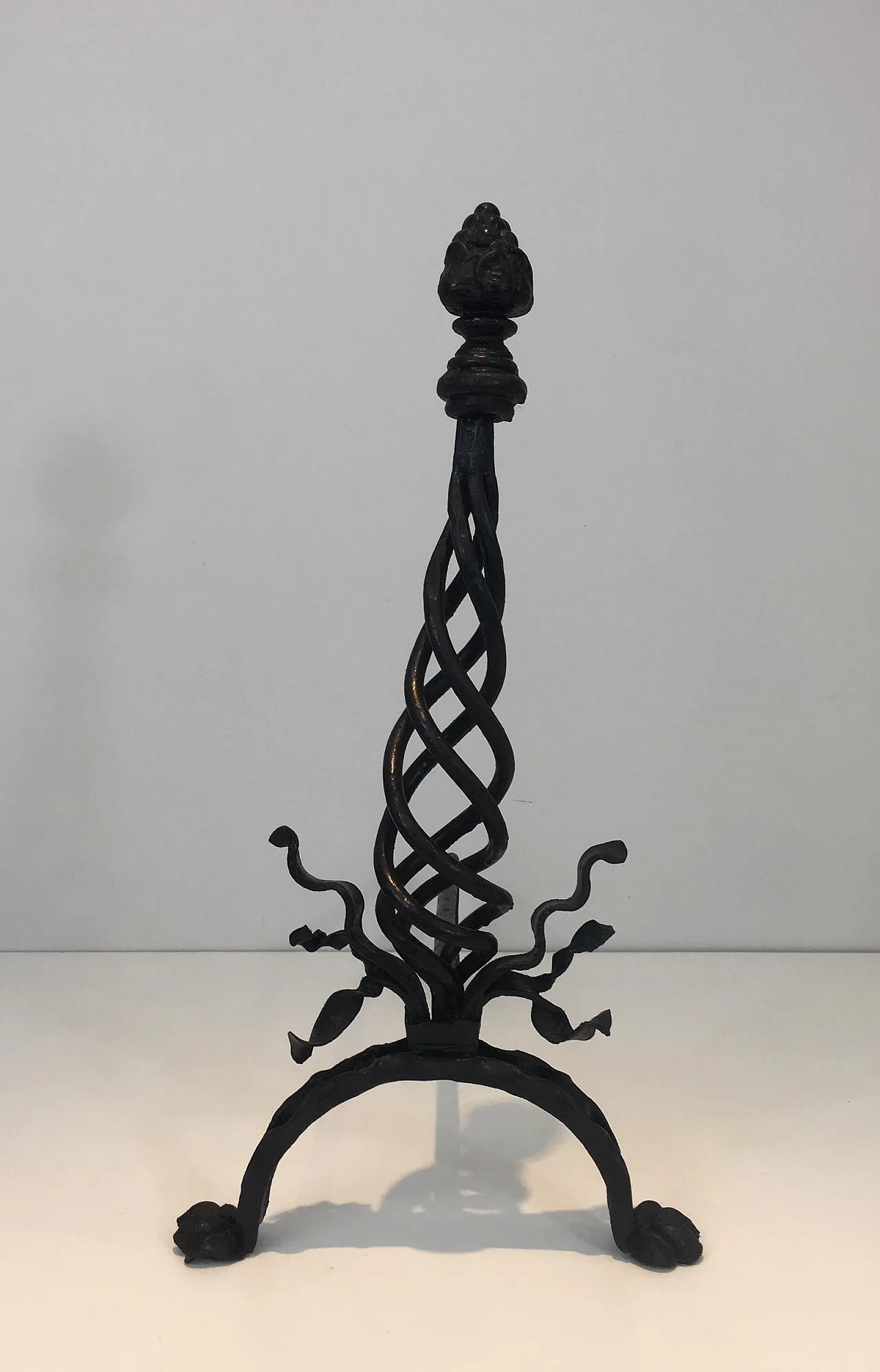 Pair of twisted wrought iron andirons with finials, French, 20s 11