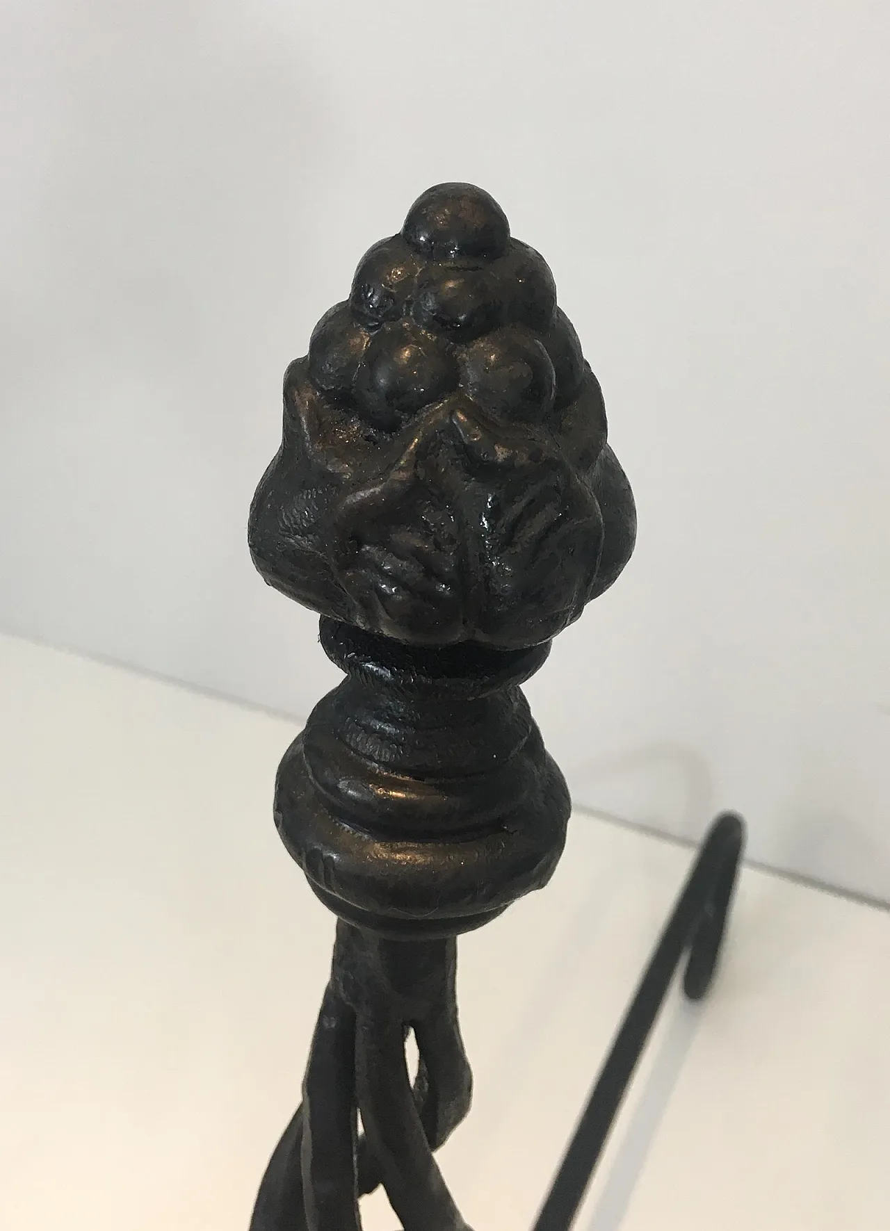 Pair of twisted wrought iron andirons with finials, French, 20s 16