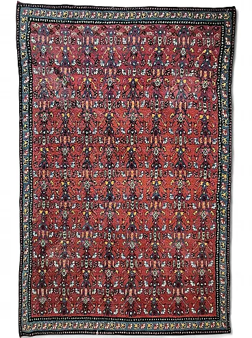 Middle Eastern hand-knotted wool rug with red floral, 1950s