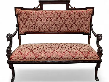 Wooden sofa with lion-head armrests and red fabric, 19th century